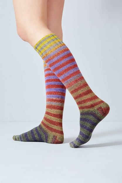 Merino and nylon knit yellow, rust, purple, and tan stripe socks from Urth