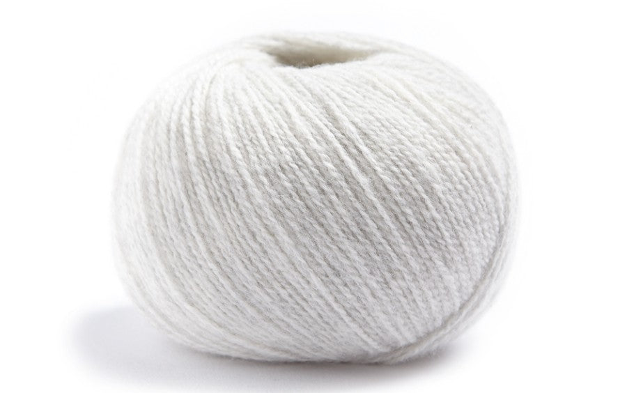 Bright White ball of merino wool and cashmere yarn from Lamana
