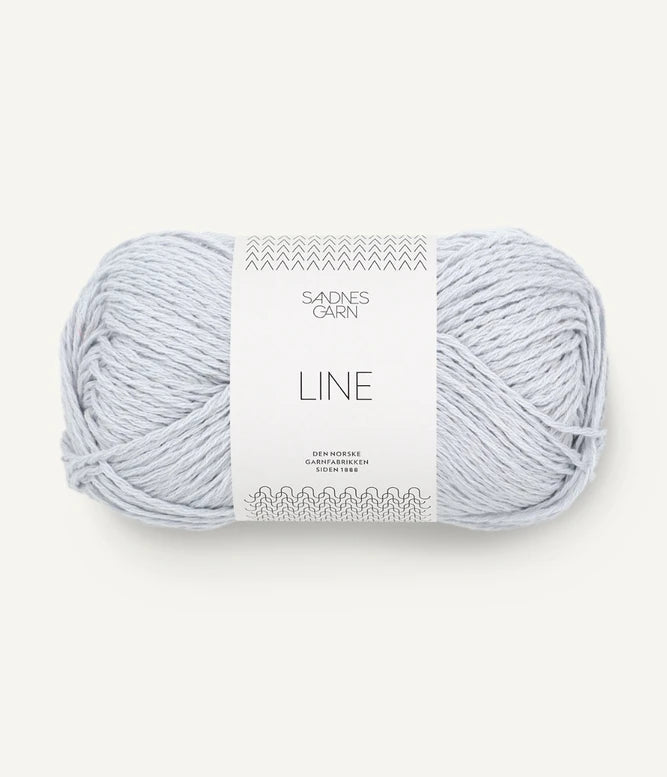 A ball of ice blue coloured cotton/linen/viscose yarn labeled 'Line' by Sandnesgarn