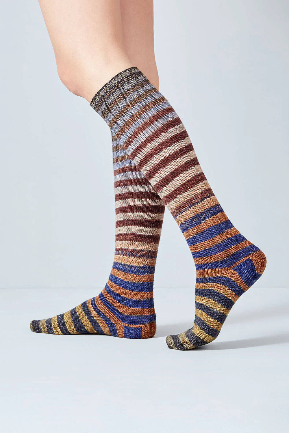 Merino and nylon knit brown, beige, blue, and grey stripe socks from Urth