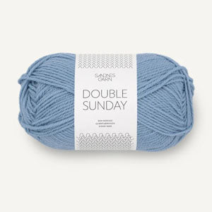 A ball of pale blue coloured merino wool yarn labeled 'Double Sunday' by Sandnesgarn.