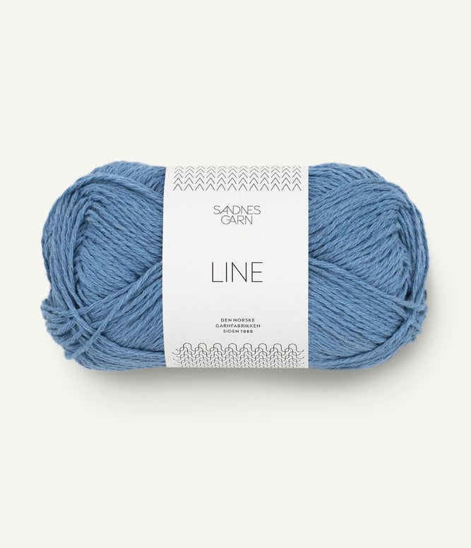 A ball of regatta blue coloured cotton/linen/viscose yarn labeled 'Line' by Sandnesgarn