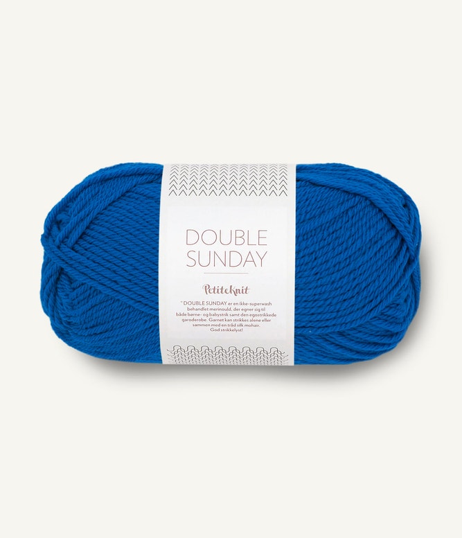 A ball of electric blue coloured merino wool yarn labeled 'Double Sunday' by Sandnesgarn.