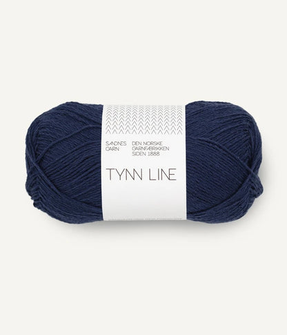 A ball of deep navy cotton/linen/viscose yarn labeled 'TYNN LINE' by Sandnes Garn