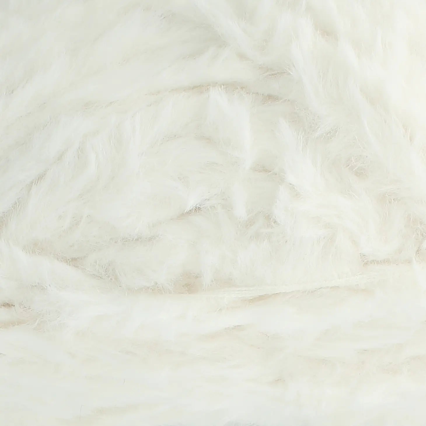 A skein of King Cole Velveteen polyester yarn in Velvet Snow white colour. 