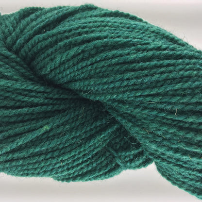 Close-up of a skein of dark green coloured wool yarn