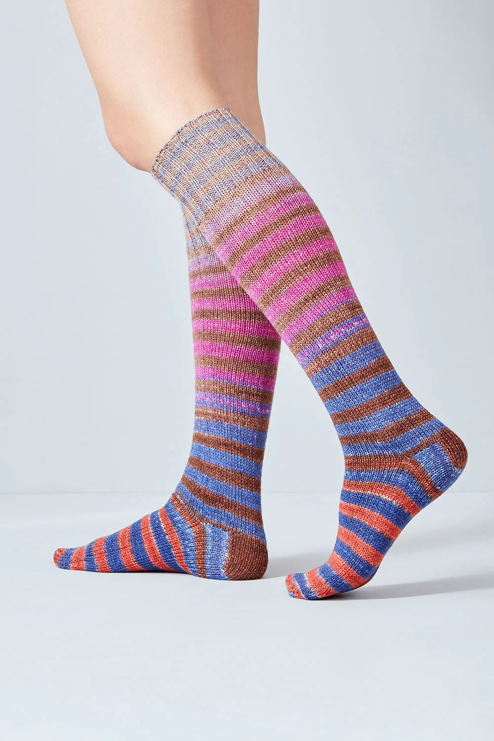 Merino and nylon knit pink, orange, blue, and brown stripe socks from Urth