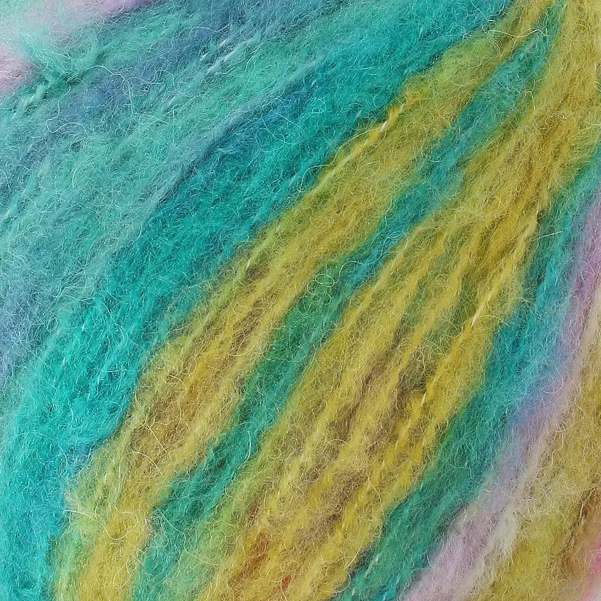 A close-up of acrylic, mohair, polyester, and wool yarn in purple green, yellow, and pink hues colours