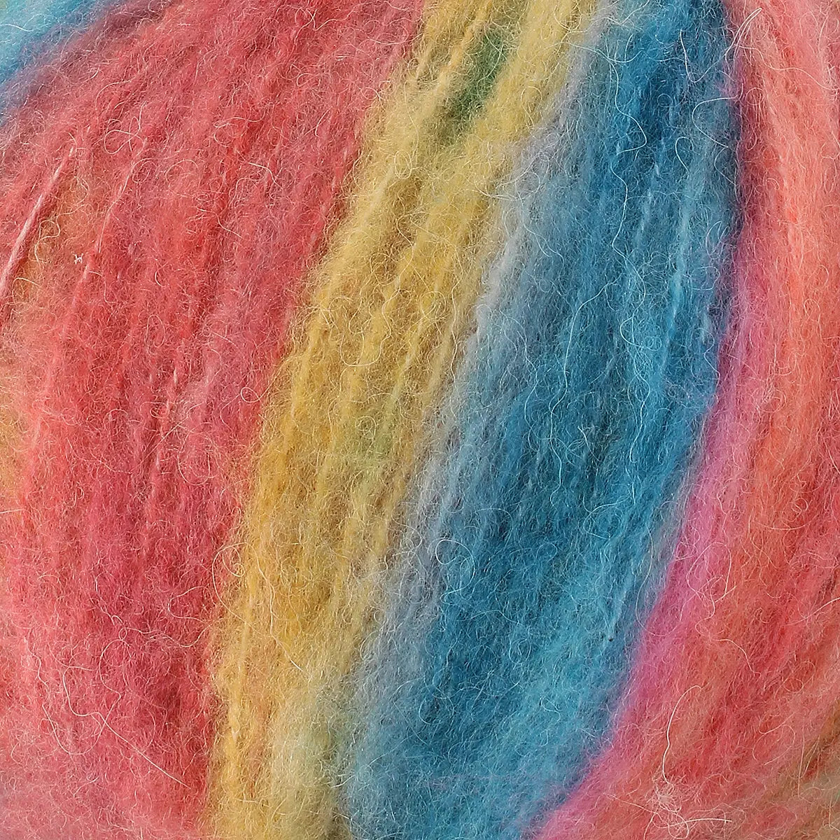 A close-up of acrylic, mohair, polyester, and wool yarn in red, yellow, and blue colours