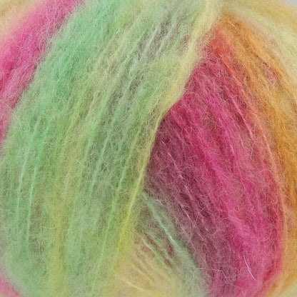 A close-up of acrylic, mohair, polyester, and wool yarn in pink, green, and yellow hues