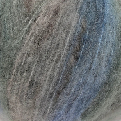 A close-up of acrylic, mohair, polyester, and wool yarn in gray, blue, and brown colors