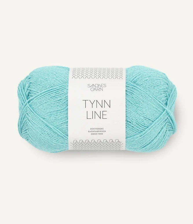 A ball of turquoise cotton/linen/viscose yarn labeled 'TYNN LINE' by Sandnes Garn