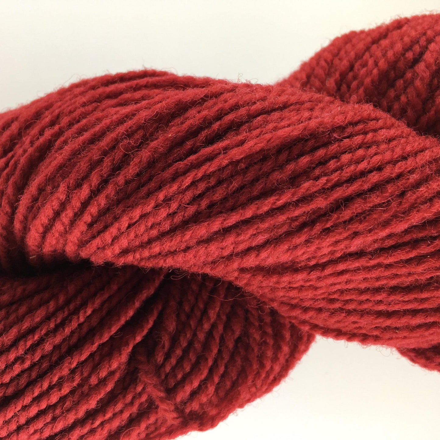 Close-up of a skein of red coloured wool yarn