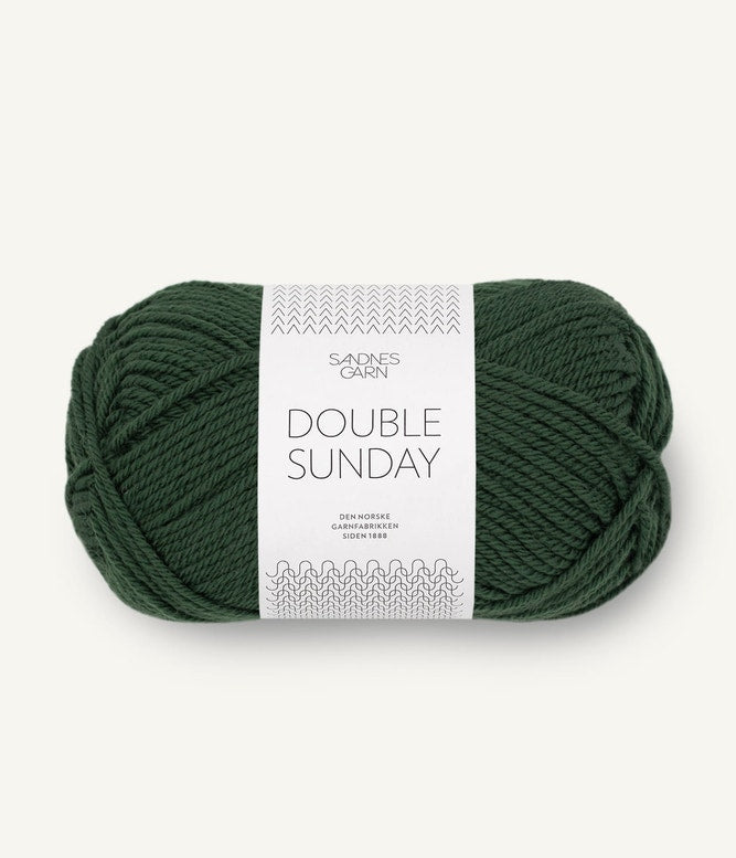 A ball of green coloured merino wool yarn labeled 'Double Sunday' by Sandnesgarn.