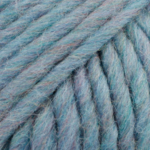 Close-up of a ball of heathered blue-colored wool yarn from Drops