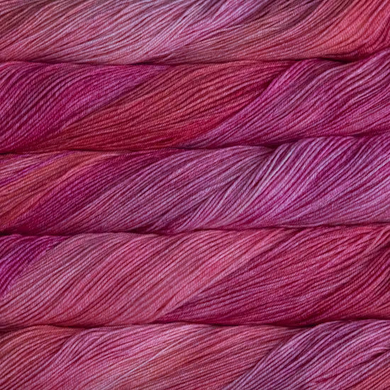 Close-up of pink and red yarn skeins
