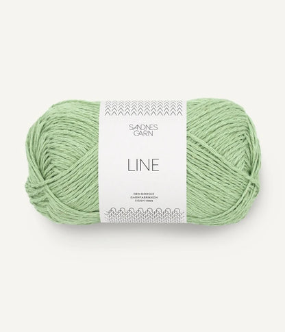 A ball of spring green coloured cotton/linen/viscose yarn labeled 'Line' by Sandnesgarn