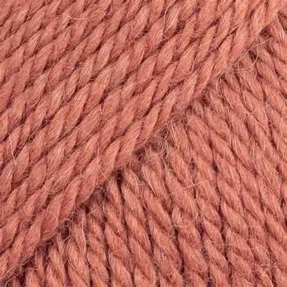 Close-up of light red-orange wool and alpaca yarn from Drops