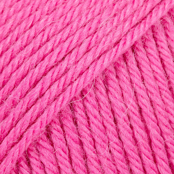 Close-up of bright pink wool and alpaca yarn from Drops
