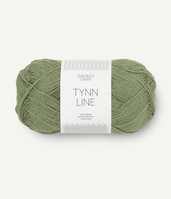 A ball of olive cotton/linen/viscose yarn labeled 'TYNN LINE' by Sandnes Garn