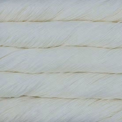 A close-up of stacked, textured off-white or cream yarn strands filling the frame.