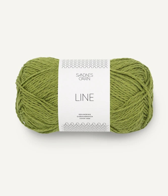 A ball of matcha coloured cotton/linen/viscose yarn labeled 'Line' by Sandnesgarn