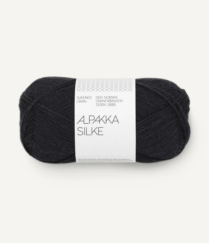 A black ball of alpaca and silk yarn from Sandnes Garn