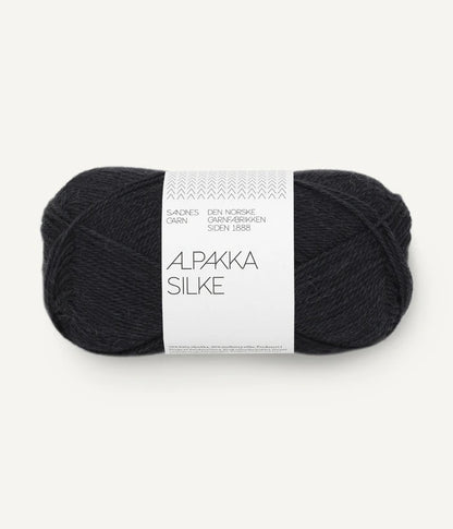 A black ball of alpaca and silk yarn from Sandnes Garn