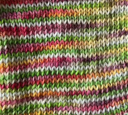 Close up knitted swatch of Blooming Bright yarn