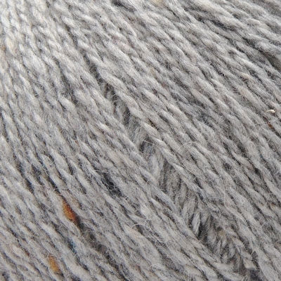 A close-up of light gray heathered yarn texture with subtle white and darker gray flecks throughout.