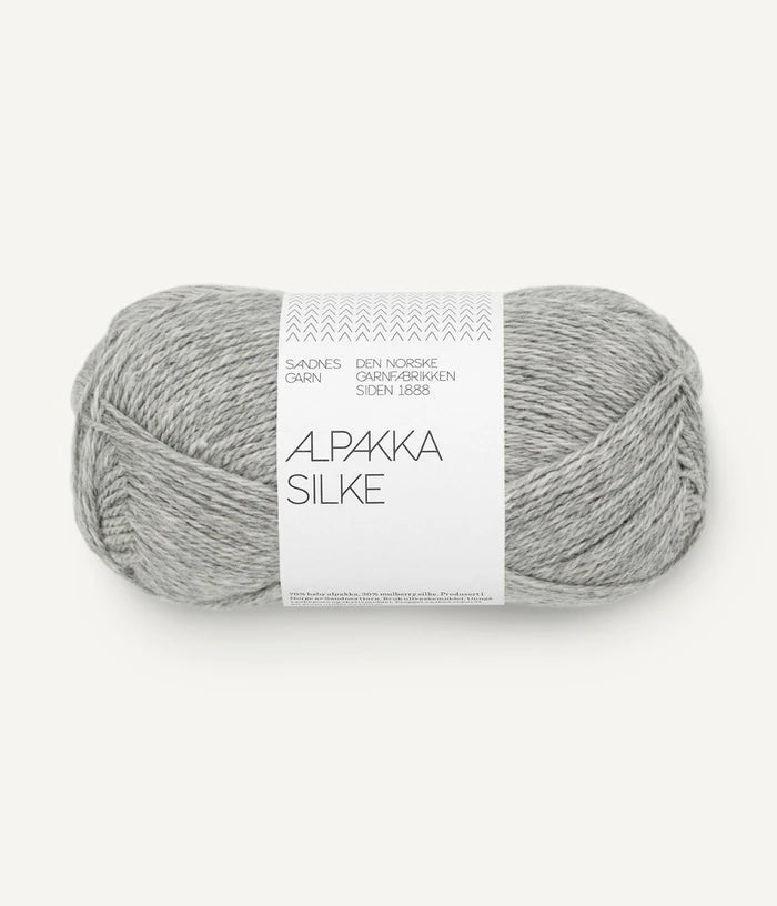 A light grey ball of alpaca and silk yarn from Sandnes Garn