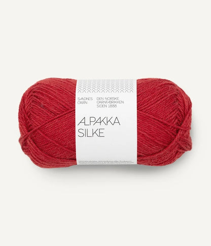 A red ball of alpaca and silk yarn from Sandnes Garn