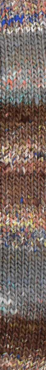 A close-up of a textured, metallic-looking fabric or material swatch with horizontal bands of silver, bronze, gold, and muted blue.