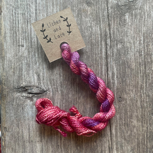 A skein of Sweet Potato pink embroidery yarn labelled 'Lichen and Lace'.