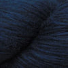 Close-up image of a skein of navy blue colored baby llama yarn.