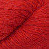 Close-up image of a skein of cherry red colored baby llama yarn.