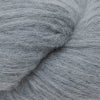 Close-up image of a skein of pewter grey colored baby llama yarn.