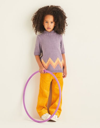 Child wearing a purple sweater with a zigzag pattern and yellow pants, holding a purple hula hoop.