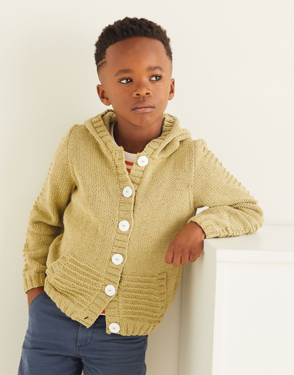 Child wearing a mustard yellow cardigan with buttons against a white background