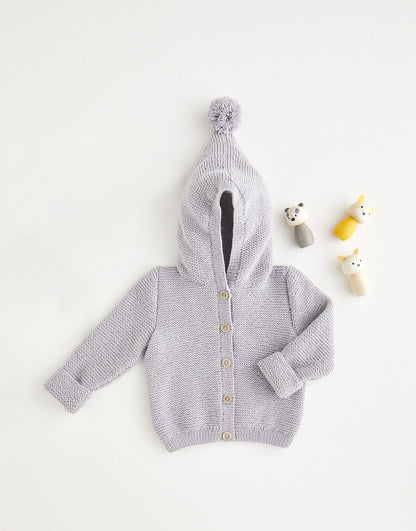 Gray knitted baby cardigan with pom-pom on the hood, on a white background
