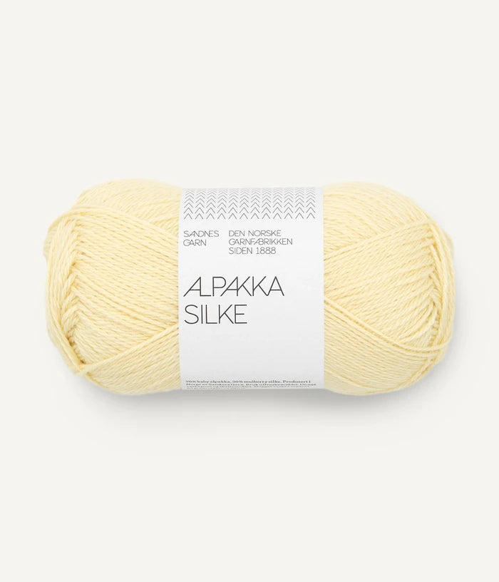A pale yellow ball of alpaca and silk yarn from Sandnes Garn