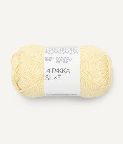 A pale yellow ball of alpaca and silk yarn from Sandnes Garn