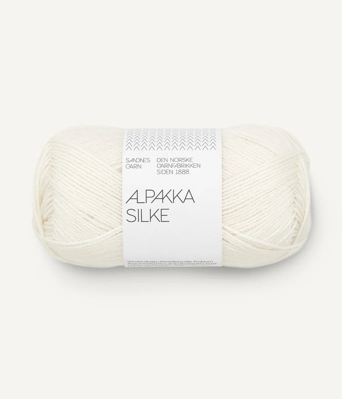 A white ball of alpaca and silk yarn from Sandnes Garn