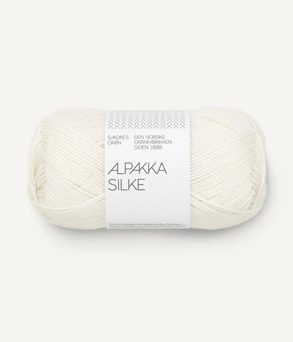 A white ball of alpaca and silk yarn from Sandnes Garn