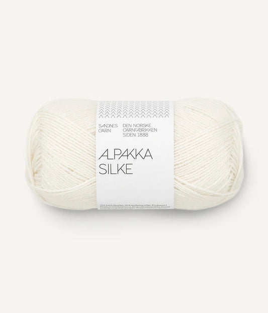 A white ball of alpaca and silk yarn from Sandnes Garn