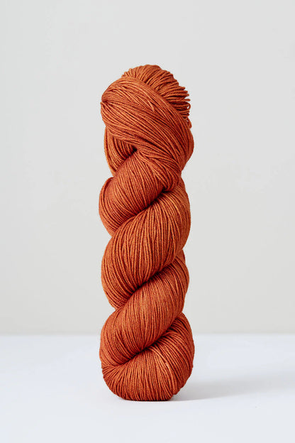 A skein of rusty superwash merino wool from Urth 