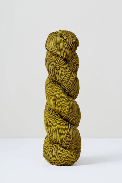 A skein of yellow/green superwash merino wool from Urth 