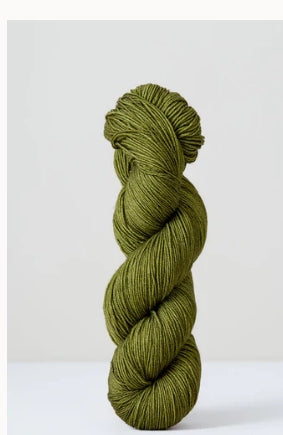 A skein of green superwash merino wool from Urth 