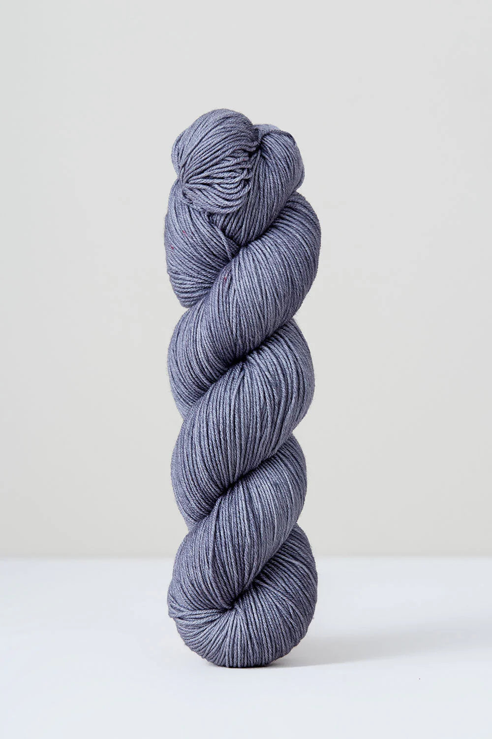 A skein of purple/grey superwash merino wool from Urth 
