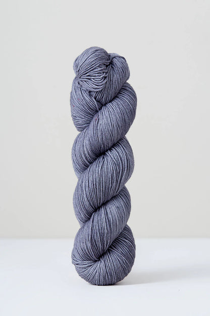 A skein of purple/grey superwash merino wool from Urth 